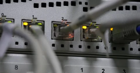Details of UTP cables, blinking LED lights and RJ 45 on working Ethernet 库存影片 58248124