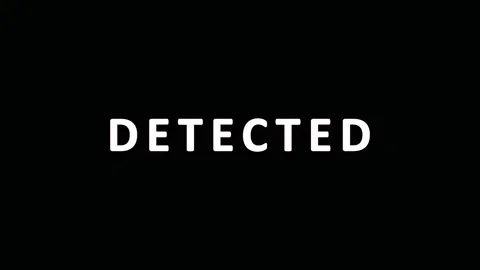 DETECTED text appearing with subtle glitch effects during a cinematic seque.. Video stock 343478591