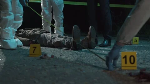 Detective and forensic scientists working hard at crime scene near headless body Video stock 283865903