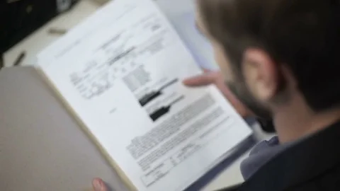 Detective checking arrest report, offense incident summary, confidential memo Video stock 85084079