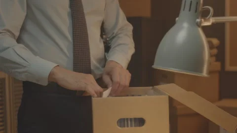 Detective Examining Evidence Box while Working in Office Stock Footage 250013682
