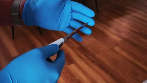 Detective Expert Examining Murder Weapon At Crime Scene Stock Footage 337257272