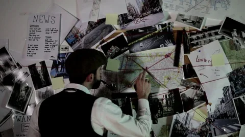 The detective looks at the map. Stock Footage 120364316