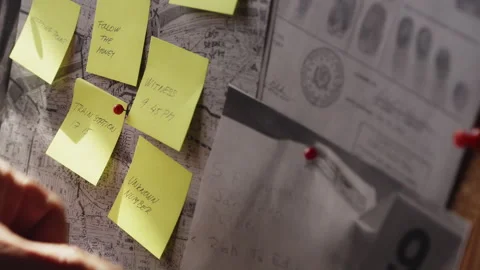Detective Marks Unknown Number Lead on Crime Investigation Map Board Stock Footage 337490454