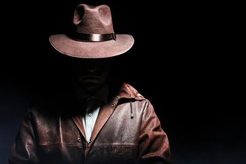 Detective standing in hat. Stock Photos