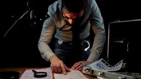 Detective while examining documents of the Zodiac serial killer case Stock Footage 150942003