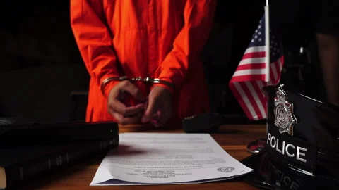 Detectives and prisoner in dark interrogation room Stock Footage 276830442