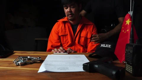 Detectives and prisoner in dark interrogation room Stock Footage 276830702