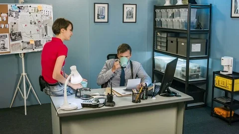Detectives drink coffee and have a rest at the police station Video stock 70513680