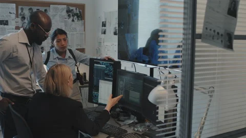Detectives Having Briefing in Office Stock Footage 199271007