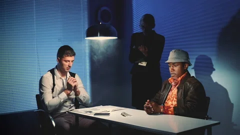 Detectives questioning suspect offender and showing him criminal evidences Stock-Footage 151953934