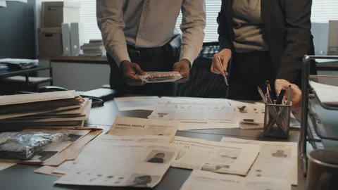 Detectives Working with Evidence Stock Footage 199262090