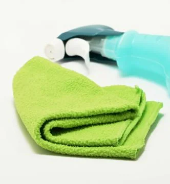 Detergent and rag on white Stock Photos