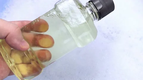 Detergent bottles float in the foam. The concept of the dangers of household che Video stock 146720336