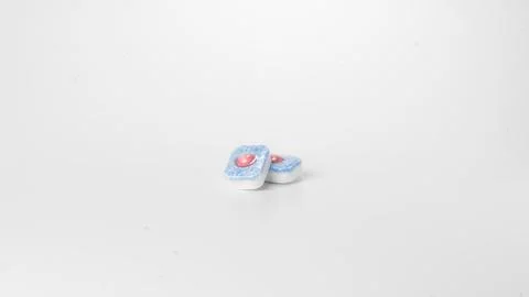 Detergent in dishwasher tablets on a white background Stock Photos