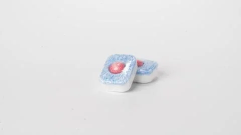 Detergent in dishwasher tablets on a white background Stock Photos
