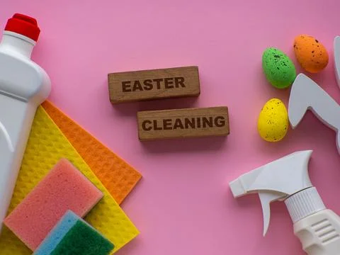 Detergent with Easter decoration on pink background with copy space Stock Photos