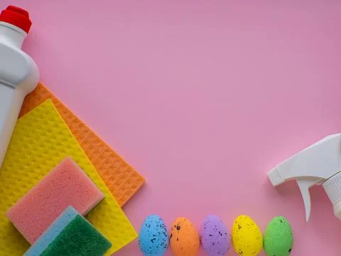 Detergent with Easter decoration on pink background with copy space Stock Photos