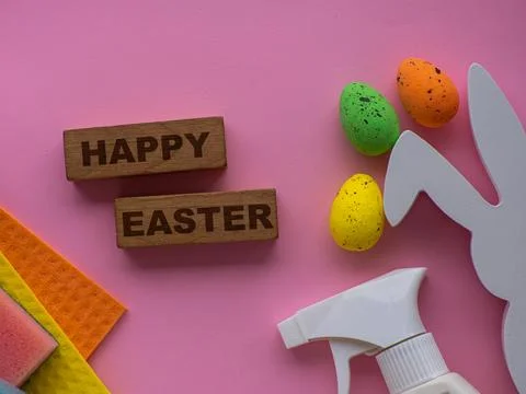 Detergent with Easter decoration on pink background with copy space Stock Photos