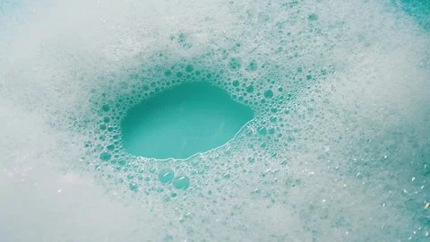 Detergent foam bubble on water. Blue background Stock Footage 339179453