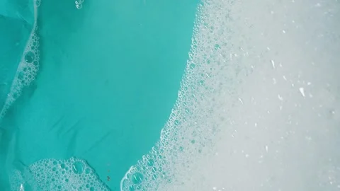 Detergent foam bubble on water. Blue background Stock Footage 339179527