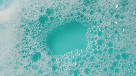 Detergent foam bubble on water. Blue background Stock Footage 339179615