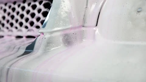 Detergent, foam, shampoo drains from the car. Stock Footage 157476452