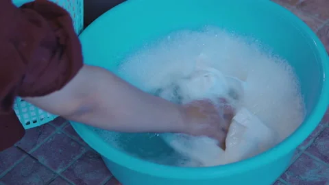 Detergent have soapy bubble water washing student clothes. Stock Footage 209128258