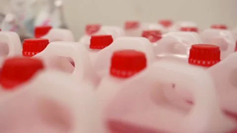 Detergent liquid in plastic canisters in the store. Rows of plastic bottles of Stock Footage 280578532