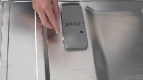 The detergent is placed in the dishwasher tray Stock Footage 239758089