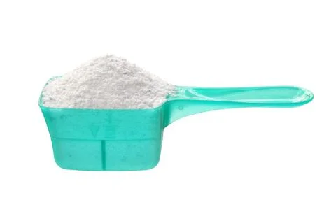Detergent powder in measuring spoon Stock Photos
