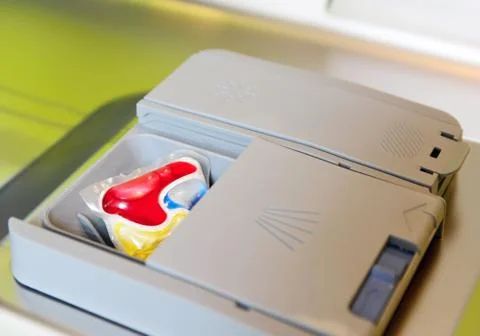Detergent tablet in dishwasher tray. Stock-Fotos