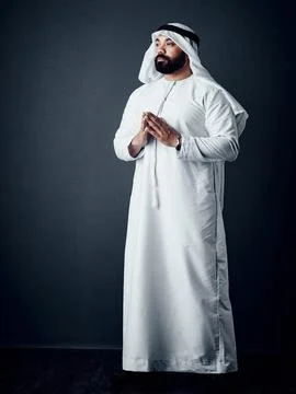 Determination and prayer will get you there. Studio shot of a young man dressed Stock Photos