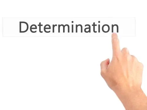 Determination - Hand pressing a button on blurred background concept on visua Foto stock