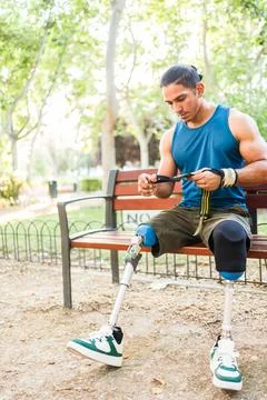 Determined amputee man preparing for outdoor calisthenics workout Stock Photos