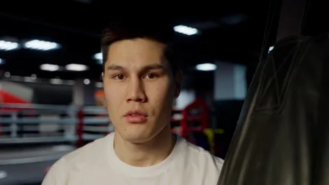 Determined boxer poised for a challenging workout. Close-up of determined male Stock Footage 261491006