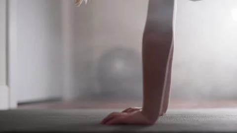 Determined boy does push ups falling and lifting body up Stock Footage 243314317