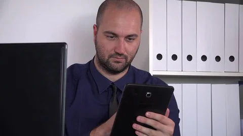 Determined confident professional worker businessman indoor with tablet portrait Stock Footage