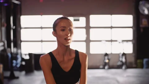 Determined Female Athlete Doing Workout In Gym Stock Footage 136669575