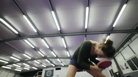 Determined female player hitting a ping pong ball Stock Footage 329068233