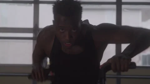 Determined Guy Rides On Exercise Bike Stock Footage 270323376