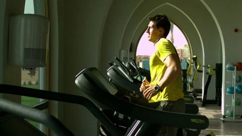 Determined man running on the treadmill in slow motion Stock Footage 81231552
