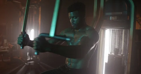 Determined man working out with exercise equipment Stock Footage 116357947