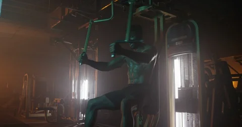 Determined man working out with exercise equipment Stock Footage 116358374