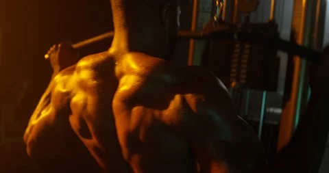 Determined man working out with exercise equipment in the gym Stock Footage 116358970