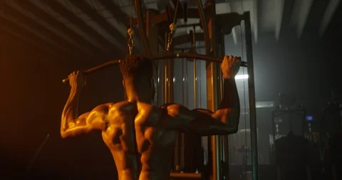 Determined man working out with exercise equipment in the gym Stock Footage 116359039