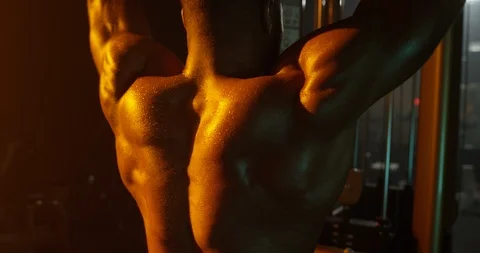 Determined man working out with exercise equipment in the gym Stock Footage 116359086