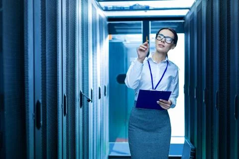 Determined operator counting service cabinets Stock Photos