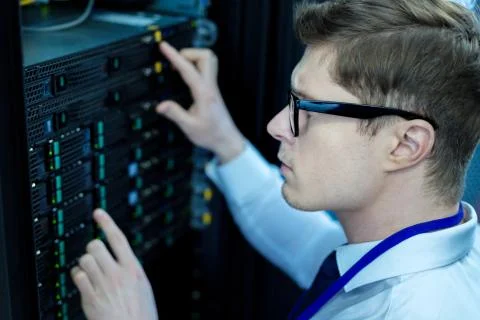 Determined operator pressing right buttons Stock Photos