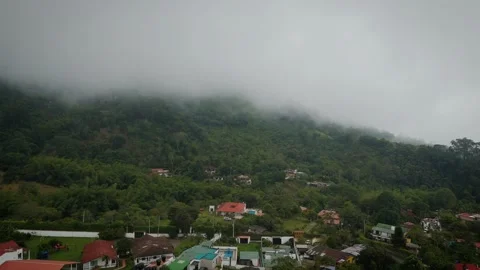 Determined Push Toward Billowing Shroud Consuming Forest-Clad Summits Stock Footage 316860404